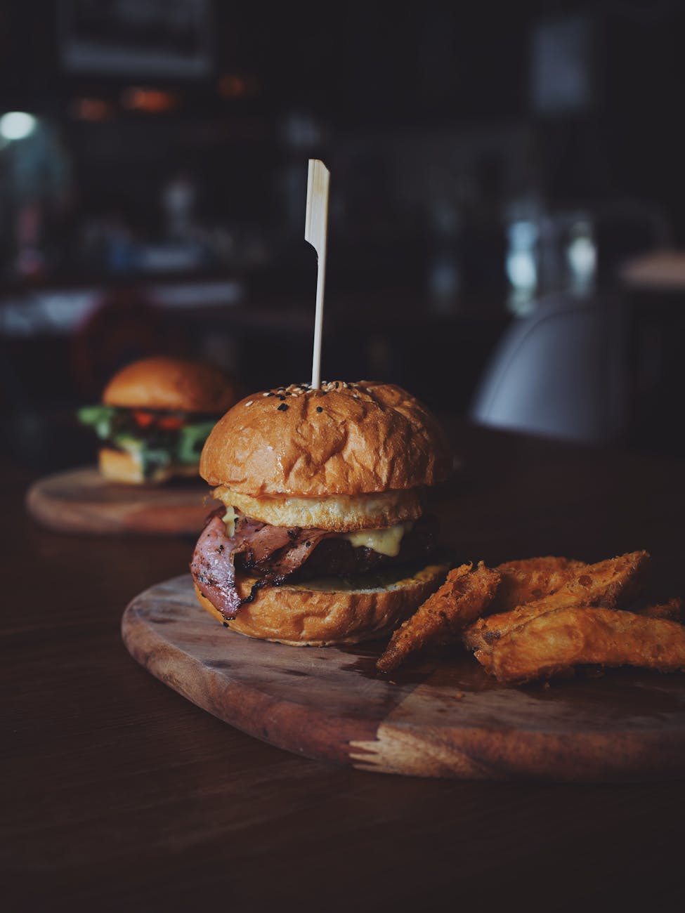 burger on brown wooden tray