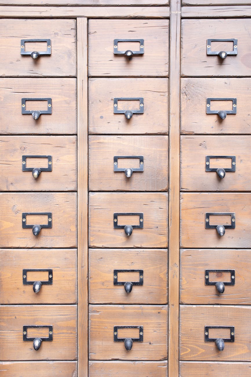 wooden cabinet with rows of drawers